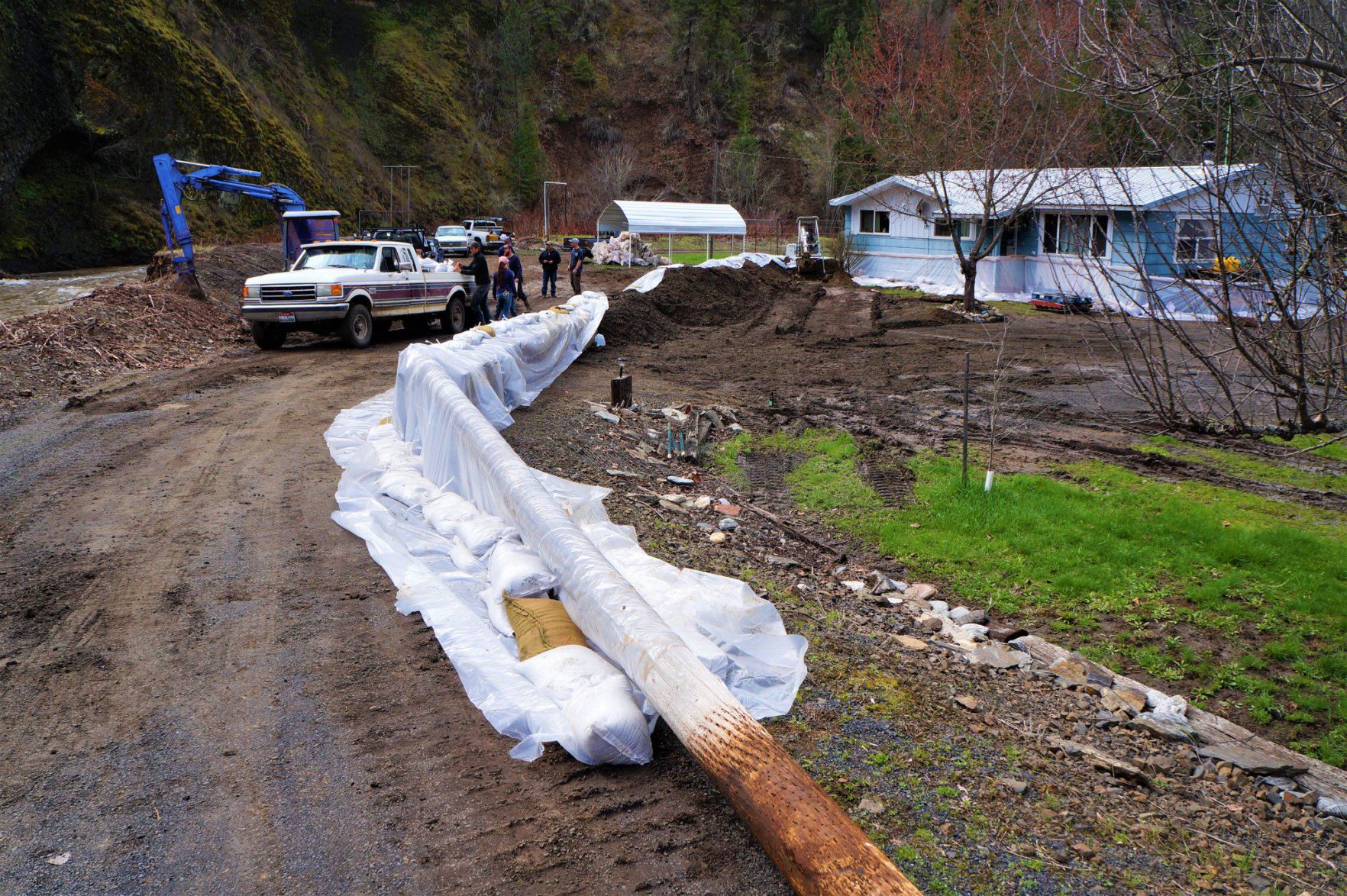 Volunteers help homeowners after flooding